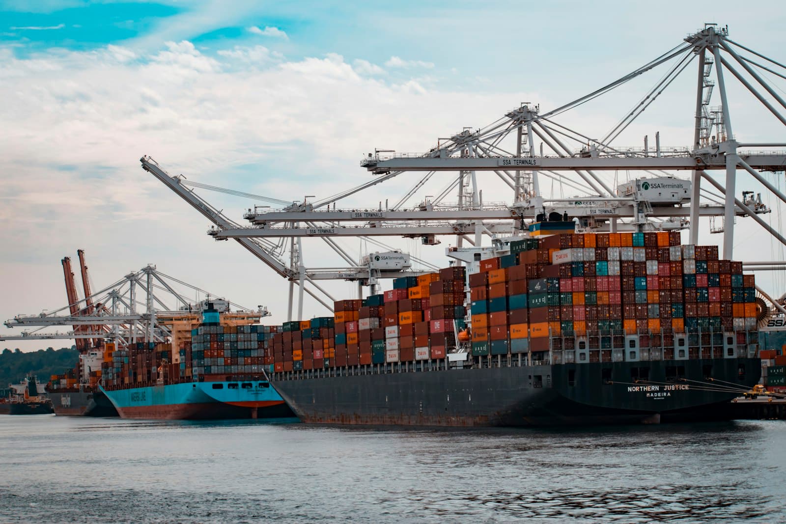 Shipping containers arranged at a commercial logistics terminal
